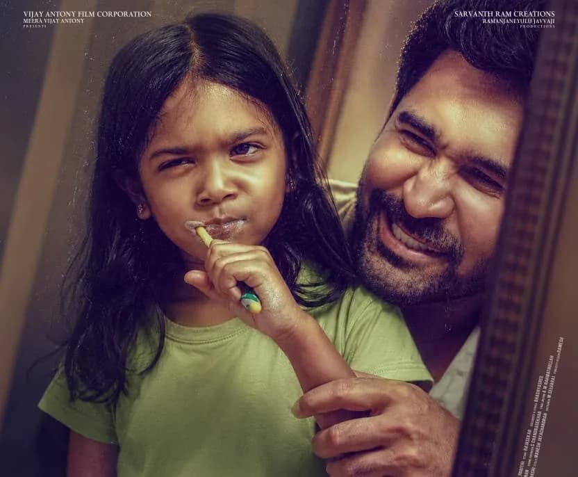 A promotional poster for Nanna Kutti showing a father and daughter in a quiet moment, soft lighting, warm tones.