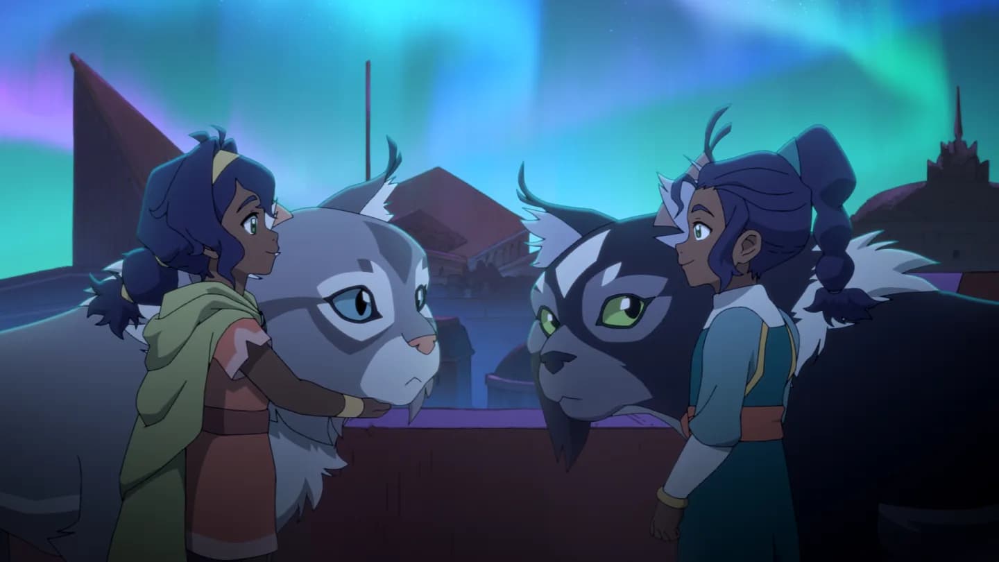 A young girl with dark hair and wide eyes stands in a vast desert, silhouetted against a sky streaked with pink and purple. A cat-monkey crouches beside her. Behind them, a walled city glows faintly in the distance.