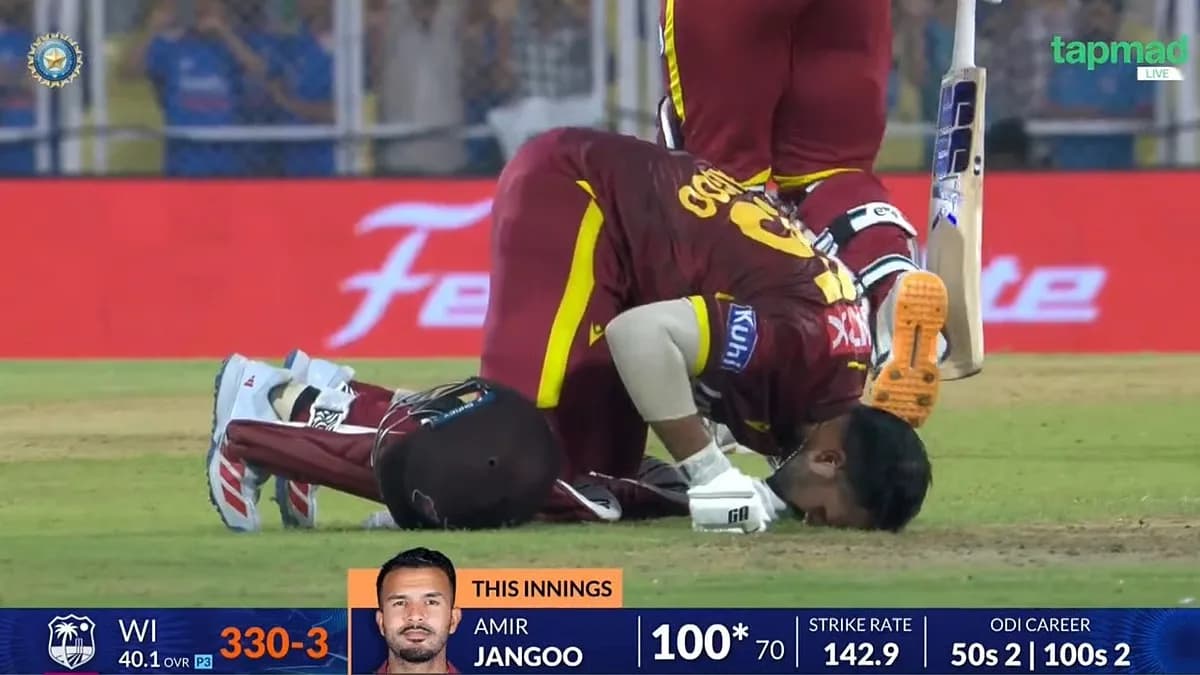 Amir Jangoo kneeling in prayer after scoring a hundred in the India vs West Indies ODI in Guwahati