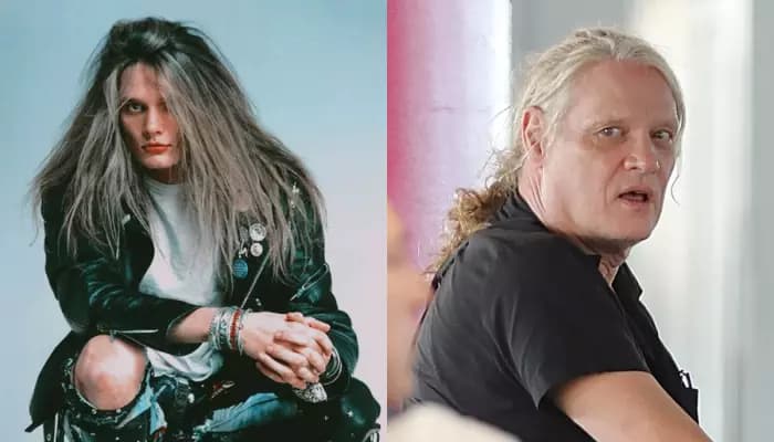 Sebastian Bach walking through Los Angeles International Airport in a black T-shirt and jogging pants with his hair tied back in a ponytail.