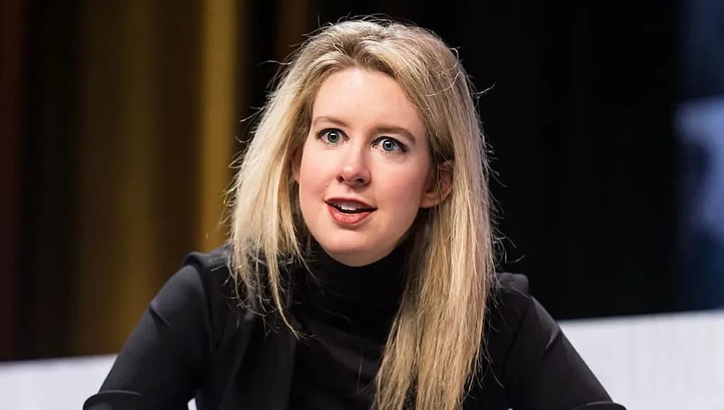 Nathan Fielder and Elizabeth Holmes stare intensely at each other in the new trailer for You Can See Everything.