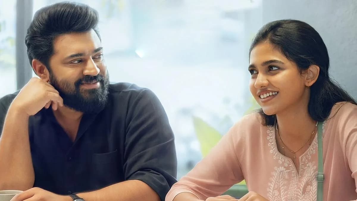 Still from Bethlehem Kudumba Unit featuring Nivin Pauly and Mamitha Baiju in a romantic scene.