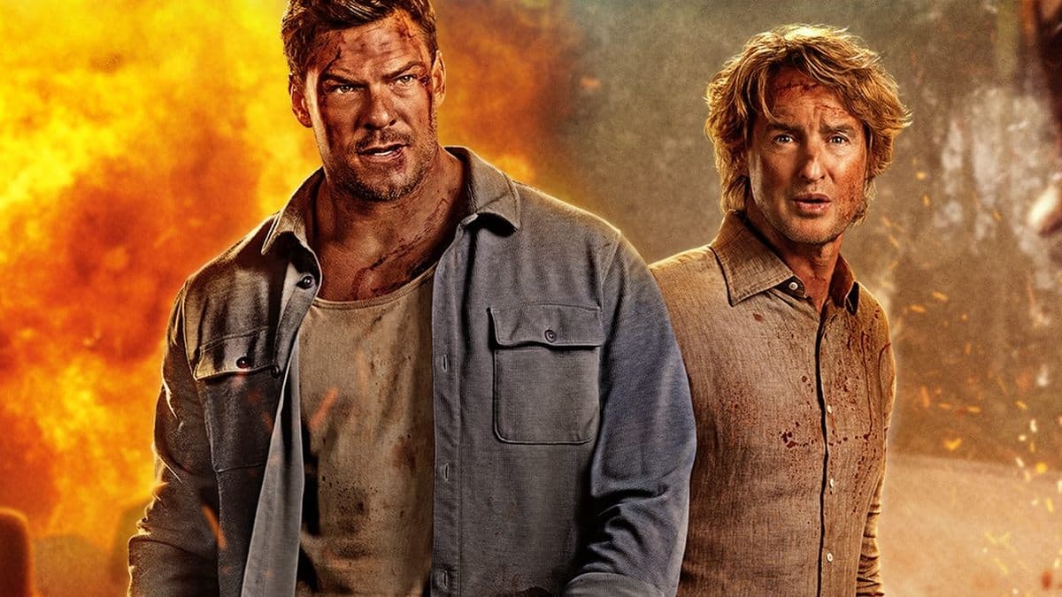 Alan Ritchson and Owen Wilson in a tense action scene from the film Runner