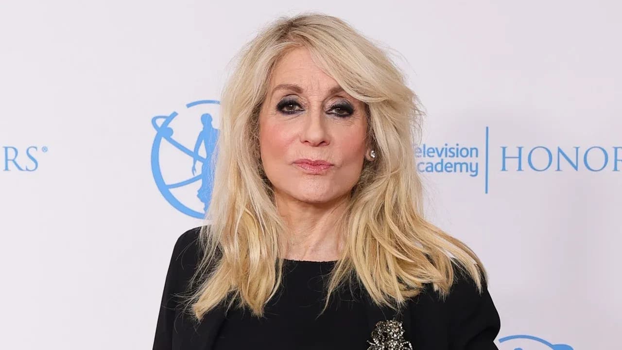 Judith Light at a red carpet event, smiling for photographers