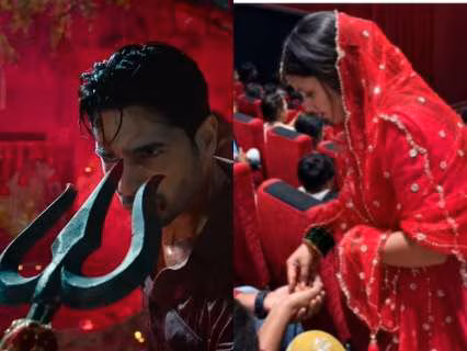 Sidharth Malhotra and Tamannaah standing in front of a temple set from The Vvaan