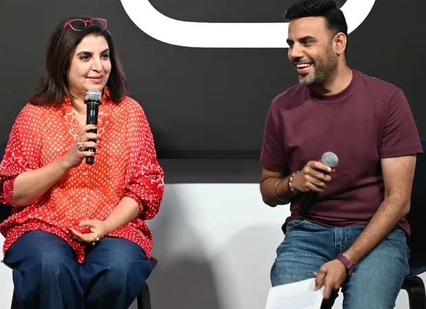 Farah Khan speaking at the Edits Film Festival in Mumbai, surrounded by young creators and digital screens displaying video edits.