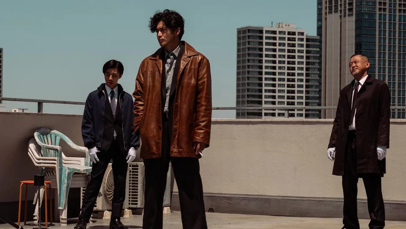Shun Oguri in character as a disheveled Tokyo detective in a neon-lit street scene from Bad Lieutenant: Tokyo