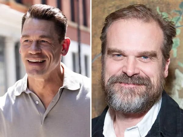 David Harbour and John Cena standing side by side, looking at a house with a 'For Sale' sign.
