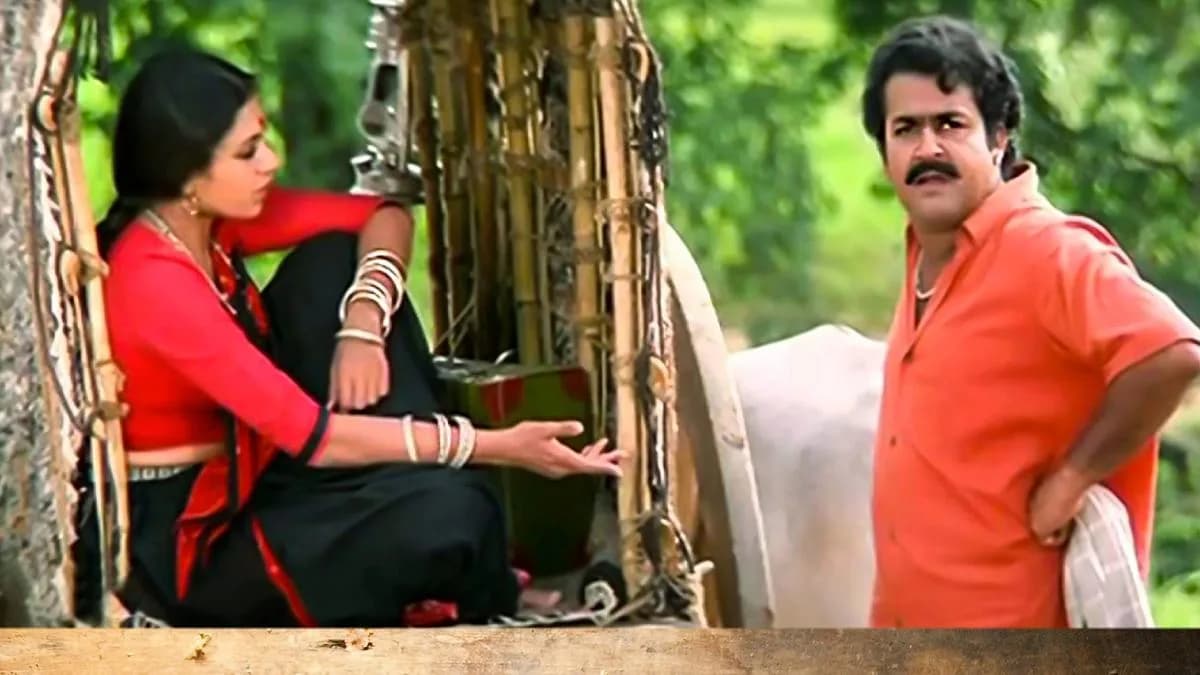 A still from Thenmavin Kombathu featuring Mohanlal and Shobana