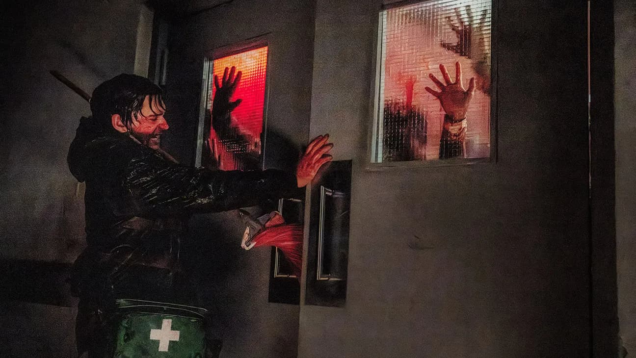 Promotional still from Zach Cregger's Resident Evil reboot showing a survivor navigating an outbreak in Raccoon City