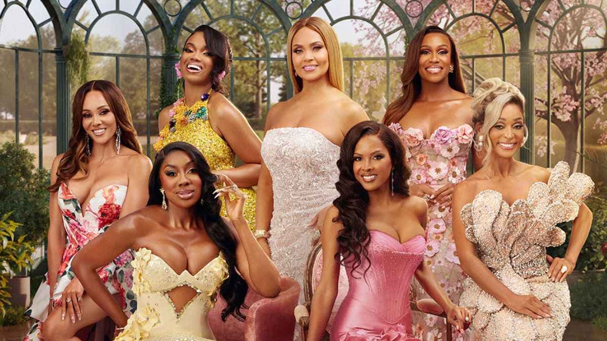 A group photo of the RHOP cast members, smiling and posing together.