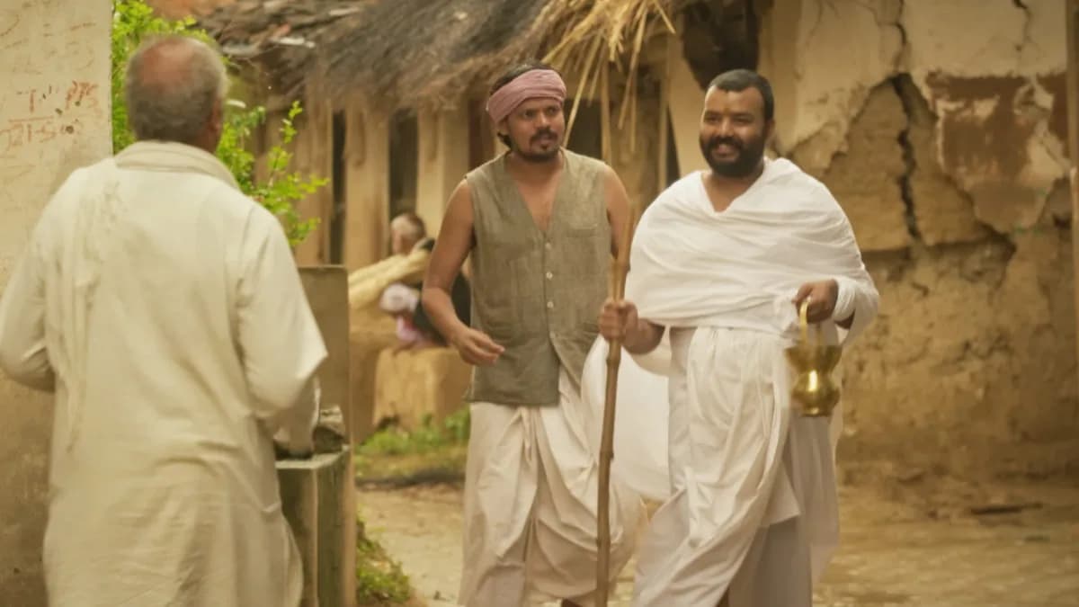 A still from Hanuman Ansh showing a temple scene with devotees in prayer.