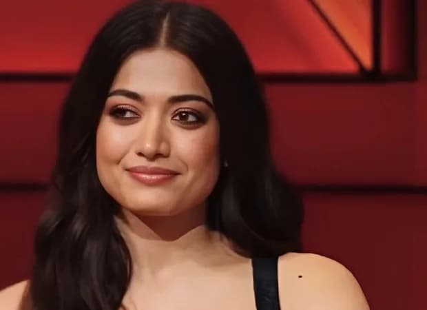 Rashmika Mandanna seated across Karan Johar during a Koffee With Karan Season 9 interview segment.