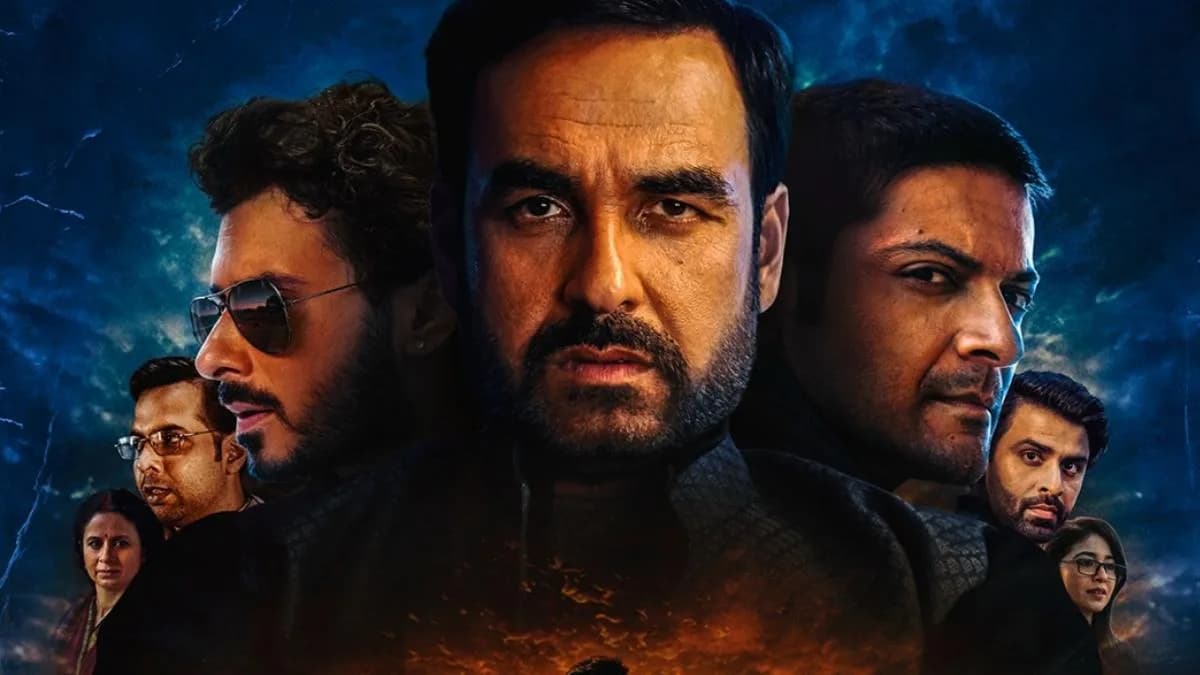 Still from Mirzapur The Movie featuring Pankaj Tripathi and Ali Fazal in a tense confrontation scene