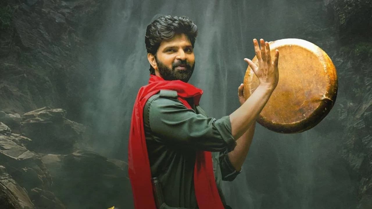 Sree Vishnu in a period action outfit, standing in front of a vintage car, mid-movement