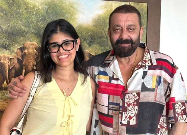 Sanjay Dutt and Anupriya Nagar standing together, smiling at the camera.