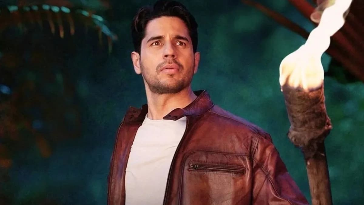 Sidharth Malhotra and Tamannaah Bhatia stand in the sacred forest holding their newborn daughter, her eyes glowing with a divine light in The Vvaan.