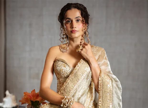 Taapsee Pannu in Gandhari, mid-action shot, intense expression, dark background.