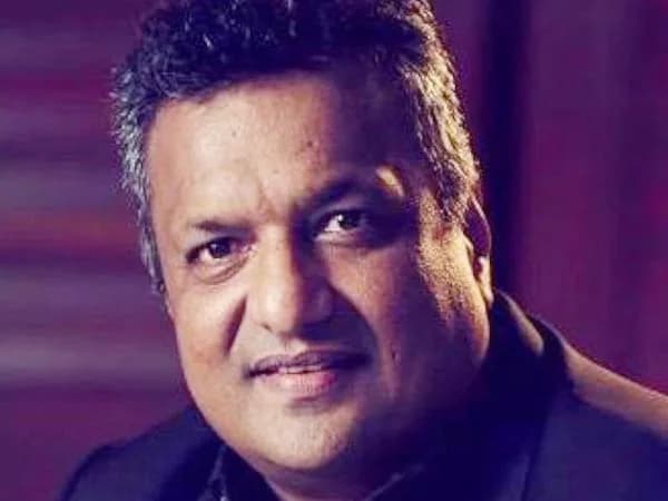 Sanjay Gupta, director of Kaante and Shootout at Wadala, in a formal portrait