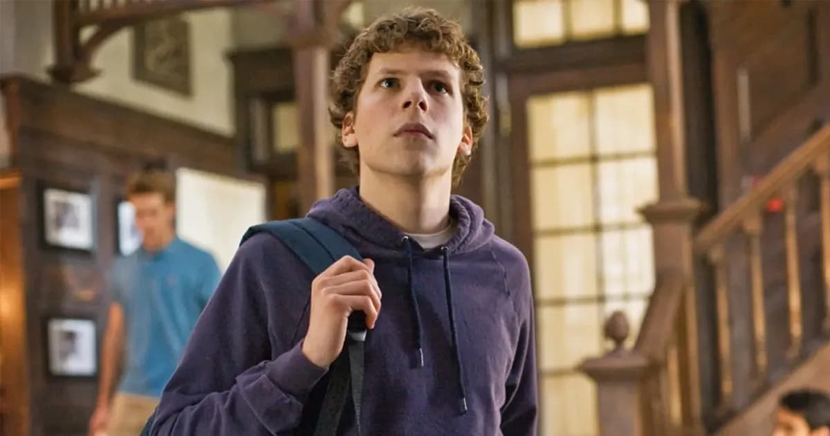 Jesse Eisenberg in a casual jacket, looking away from the camera