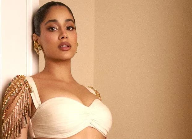 Janhvi Kapoor in an off-white saree with bare shoulders and elaborate gold and pearl jewellery draped across her arms at the BoF 500 Gala in Paris