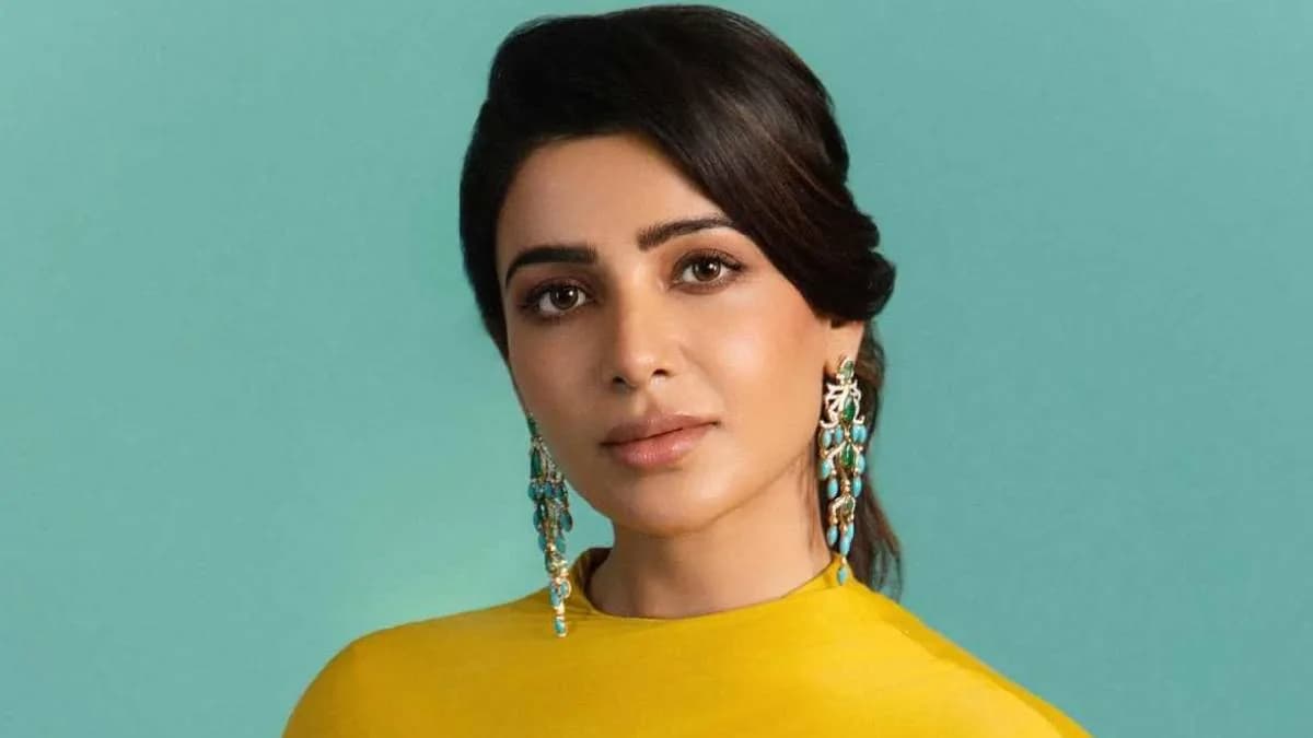 Samantha Ruth Prabhu in a simple white saree, looking composed, standing in front of a courtroom building