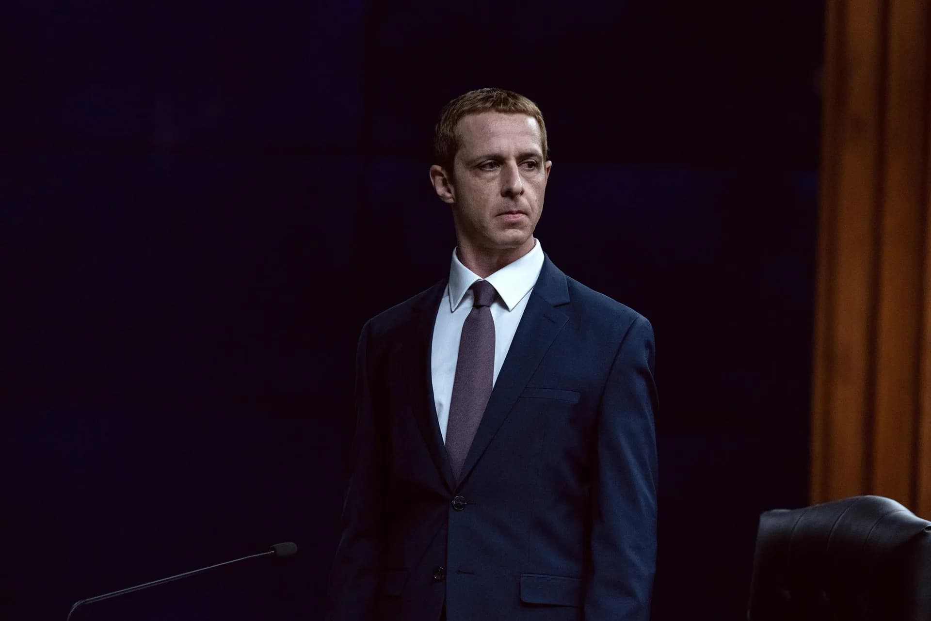 Still from The Social Reckoning featuring Jeremy Strong as Mark Zuckerberg in a tense office scene