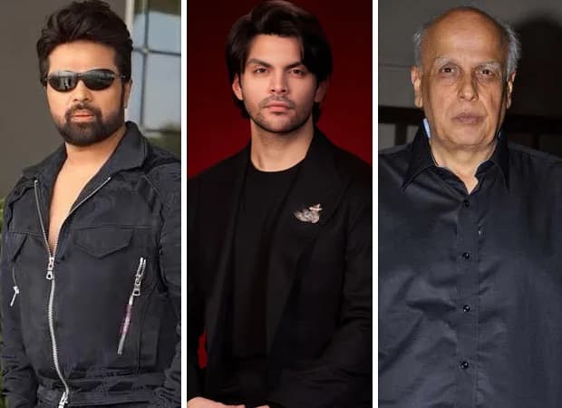 Himesh Reshammiya and Mahesh Bhatt standing side-by-side at a film event, both looking serious and focused.