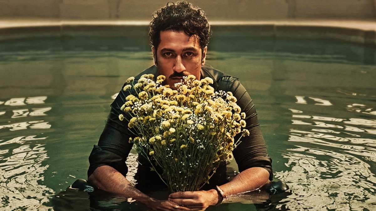 Vicky Kaushal seated in a pool holding a bouquet of flowers in a promotional poster for Love & War