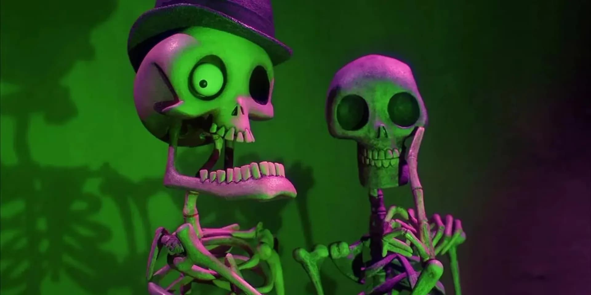A still from Tim Burton's Corpse Bride showing Victor and Emily in the Land of the Dead, surrounded by glowing spirits.