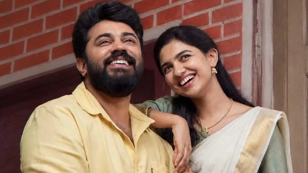 Poster of Bethlehem Kudumba Unit featuring Nivin Pauly and Mamitha Baiju against a colorful backdrop.