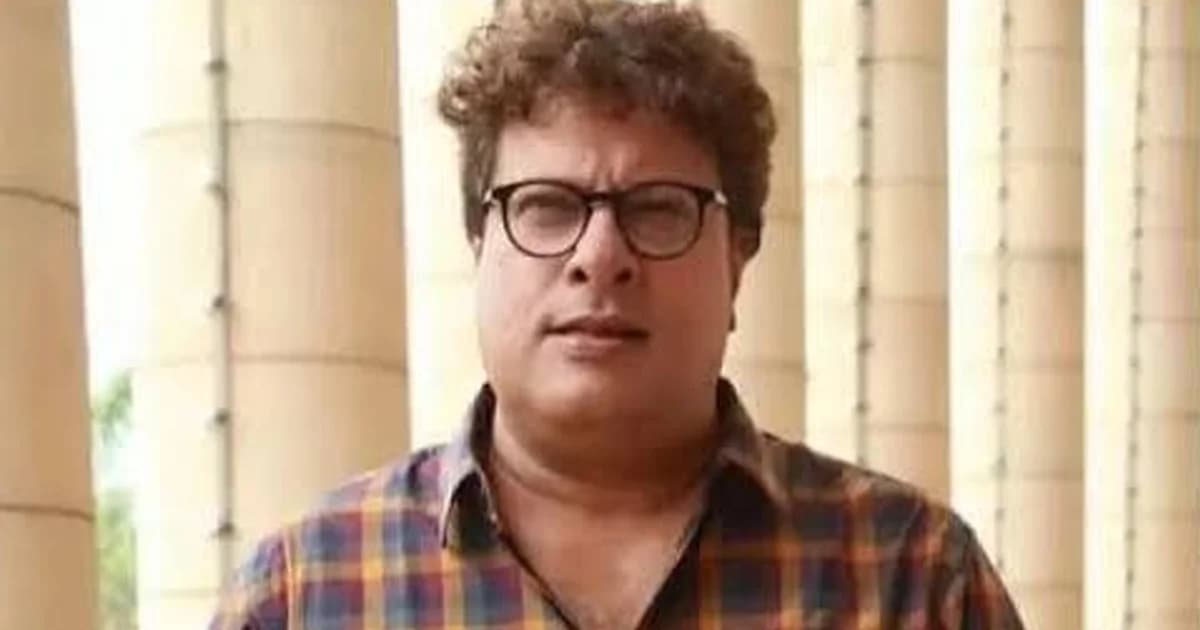 Director Tigmanshu Dhulia speaking at a public event, with a promotional poster of Dhurandhar shown alongside.