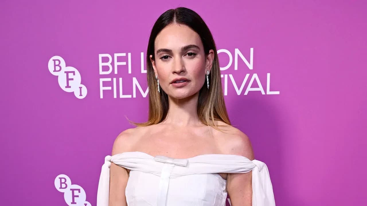 Lily James in a white off-the-shoulder Prada velvet dress at the BFI London Film Festival premiere of The Liberation