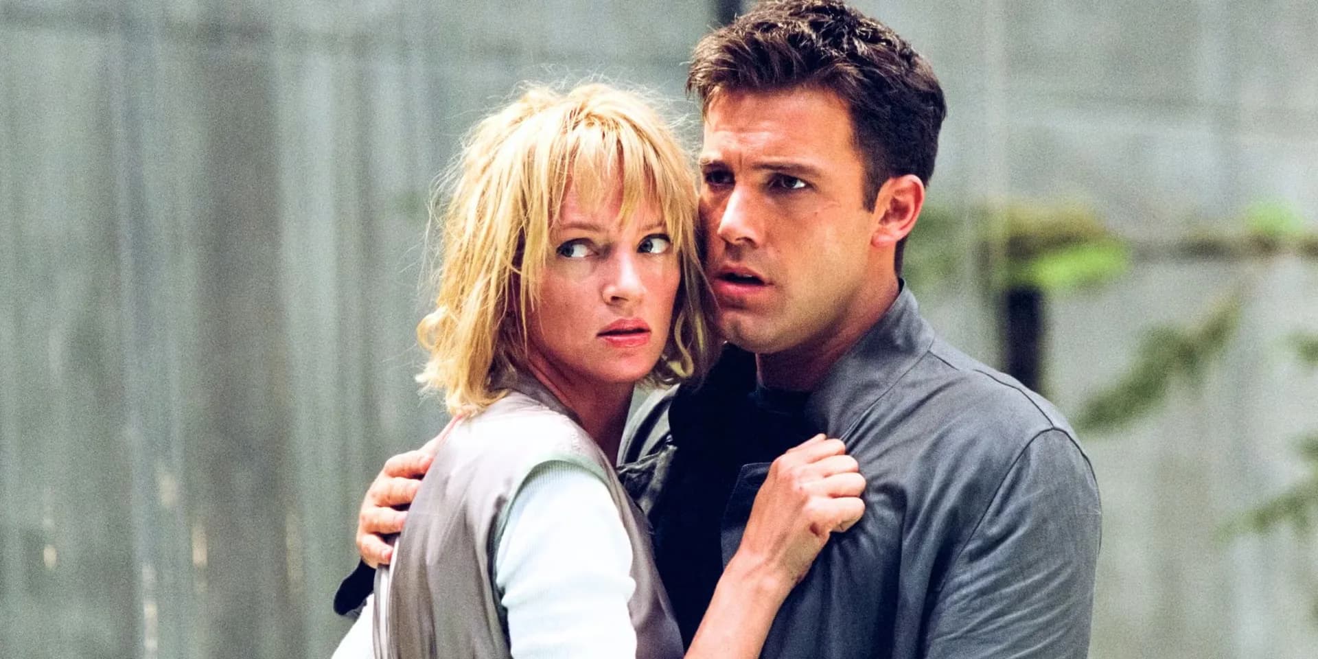 A black-and-white promotional still of Ben Affleck in Paycheck, staring into the distance, holding a small object.