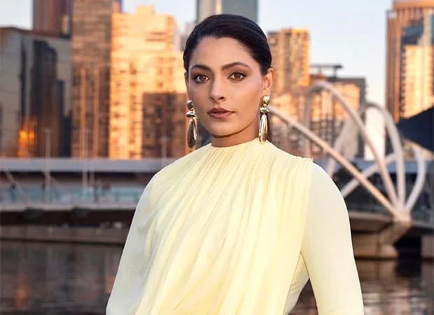 Saiyami Kher in a quiet, introspective pose, looking into the distance.