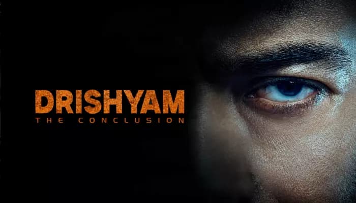 Ajay Devgn as Vijay Salgaonkar in a still from the Drishyam: The Conclusion trailer, with Jaideep Ahlawat's police officer character in the background