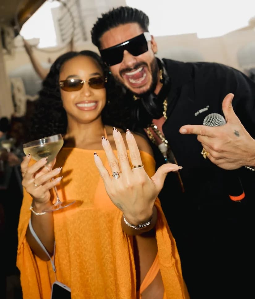 Pauly D kneeling on stage at Omnia Dayclub in Las Vegas as Nikki Hall says yes