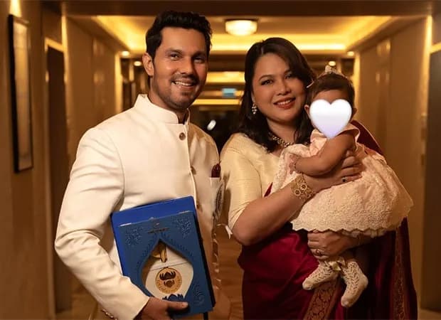 Randeep Hooda receiving the National Film Award on stage with a trophy in his hands