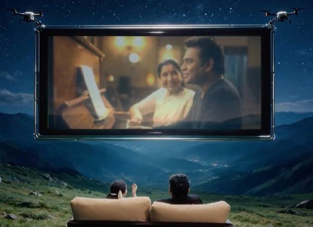 AR Rahman on stage at the launch event for the tribute song Asha Forever, with Maharashtra Chief Minister Devendra Fadnavis seated nearby