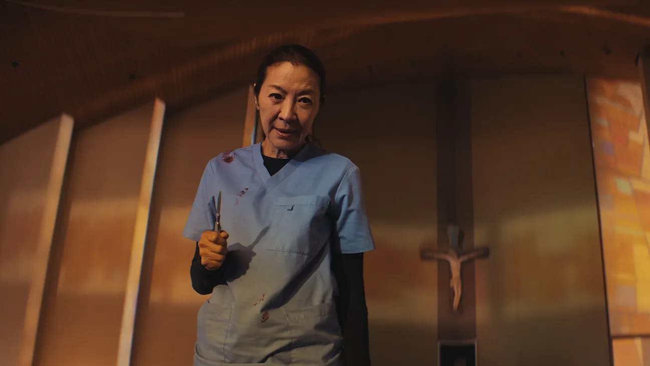 Michelle Yeoh in character as a surgeon in a tense operating room scene from the film The Surgeon