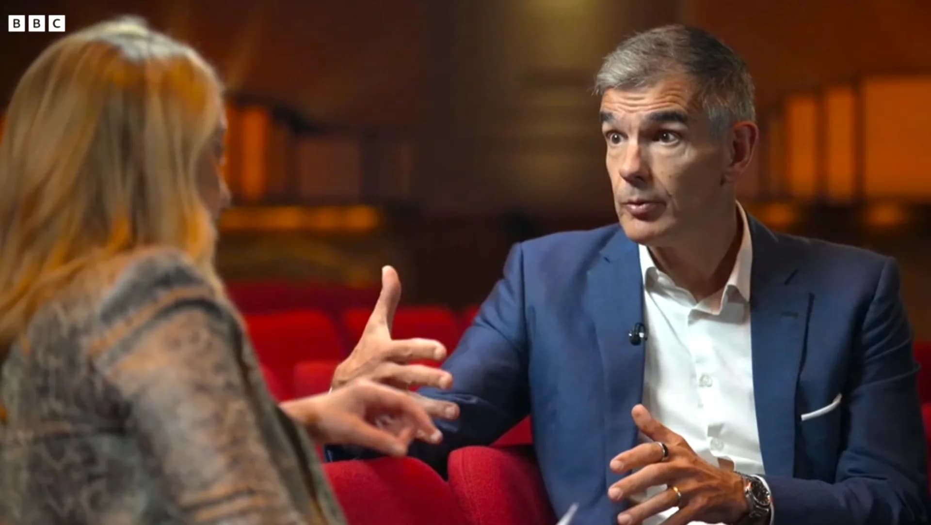 Matt Brittin speaking with Laura Kuenssberg on a BBC set