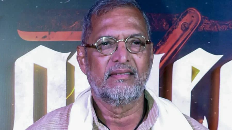 A black-and-white photo of Nana Patekar in profile, mid-speech, eyes sharp, jaw set.