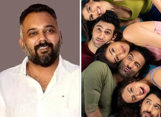 Luv Ranjan standing in front of a film set with six young actors, smiling during a rehearsal.