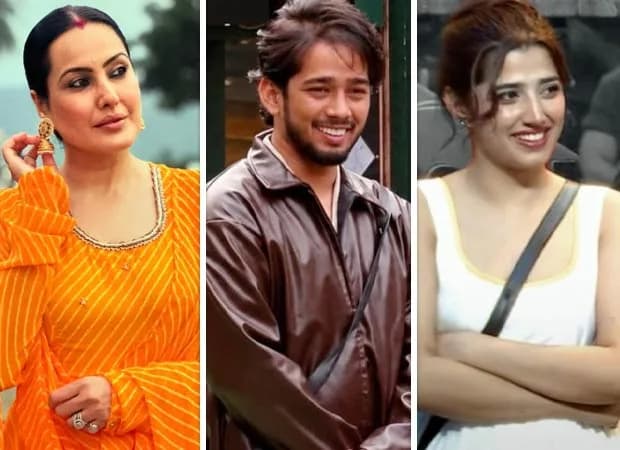 ScoutOp and Love Gill standing close together in the Bigg Boss house, surrounded by other contestants.