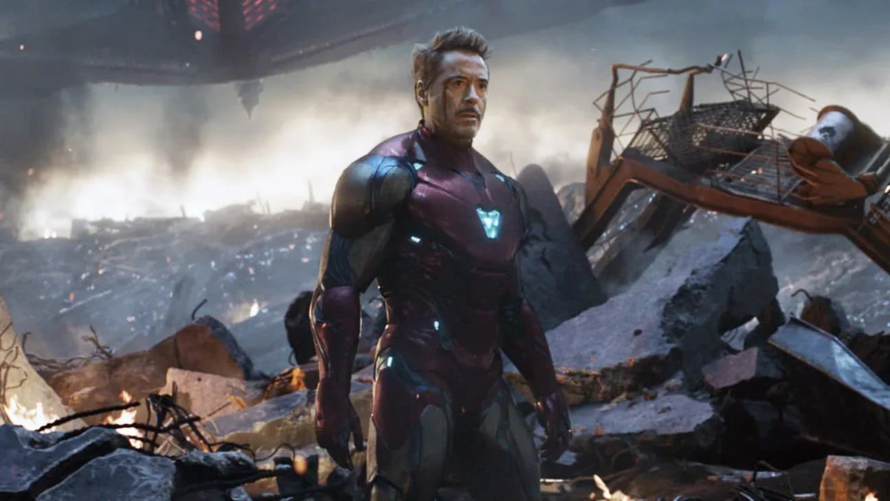 A still from Avengers: Endgame showing Iron Man and Captain America standing together, with the Earth in the background.