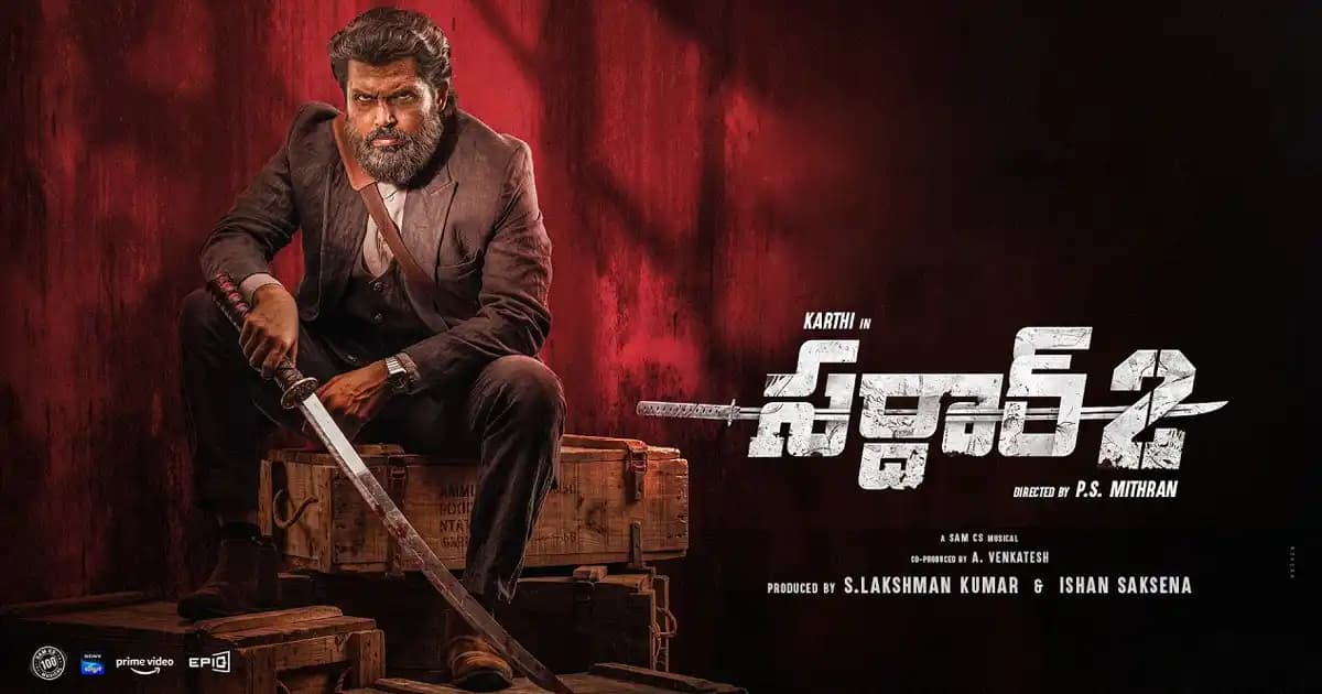 A still from Sardar 2 featuring Karthi in a dramatic pose, surrounded by shadows and action.