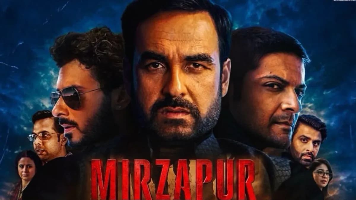 A promotional still from the Mirzapur film featuring the ensemble cast against the backdrop of rural Uttar Pradesh