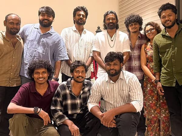 Dhanush poses with the cast and crew of the Tamil film Modha Rathri.