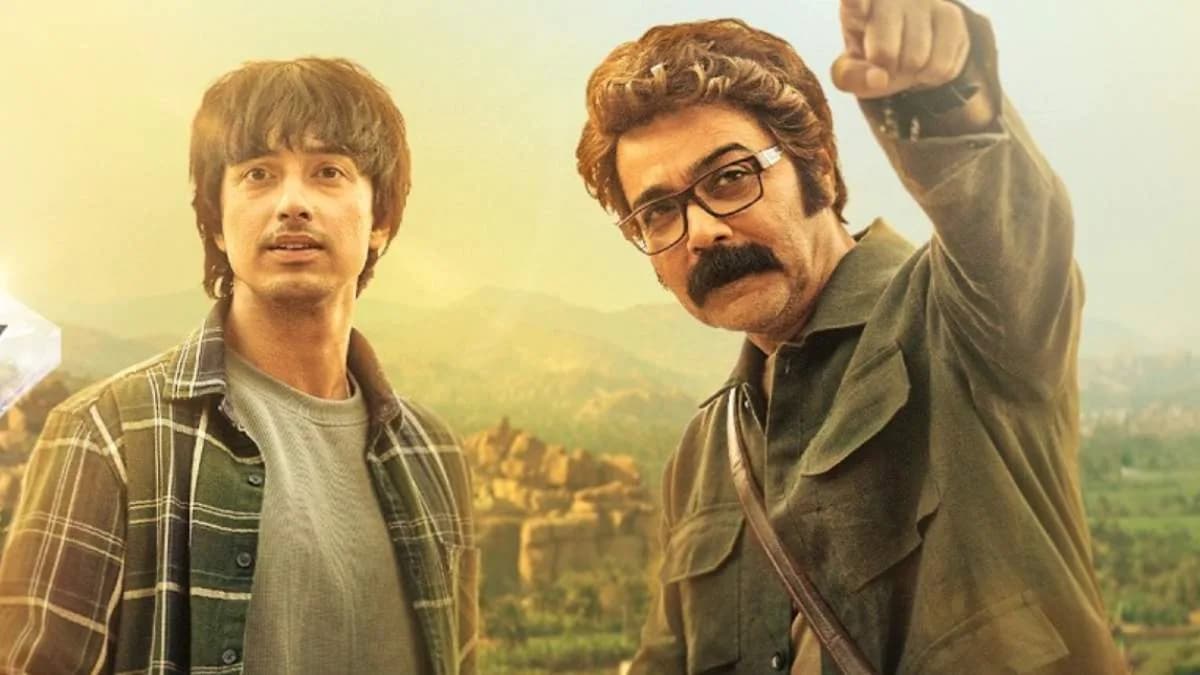 Prosenjit Chatterjee as Kakababu in a dusty heritage hotel, looking at an ancient map.