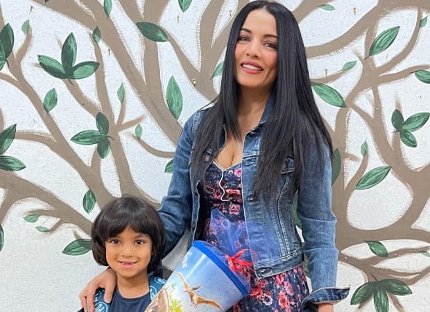 Celina Jaitly smiling in a portrait photograph shared on social media